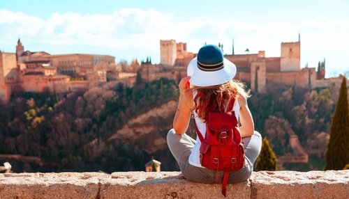 Tourist with a view of the Alhambra in Granada